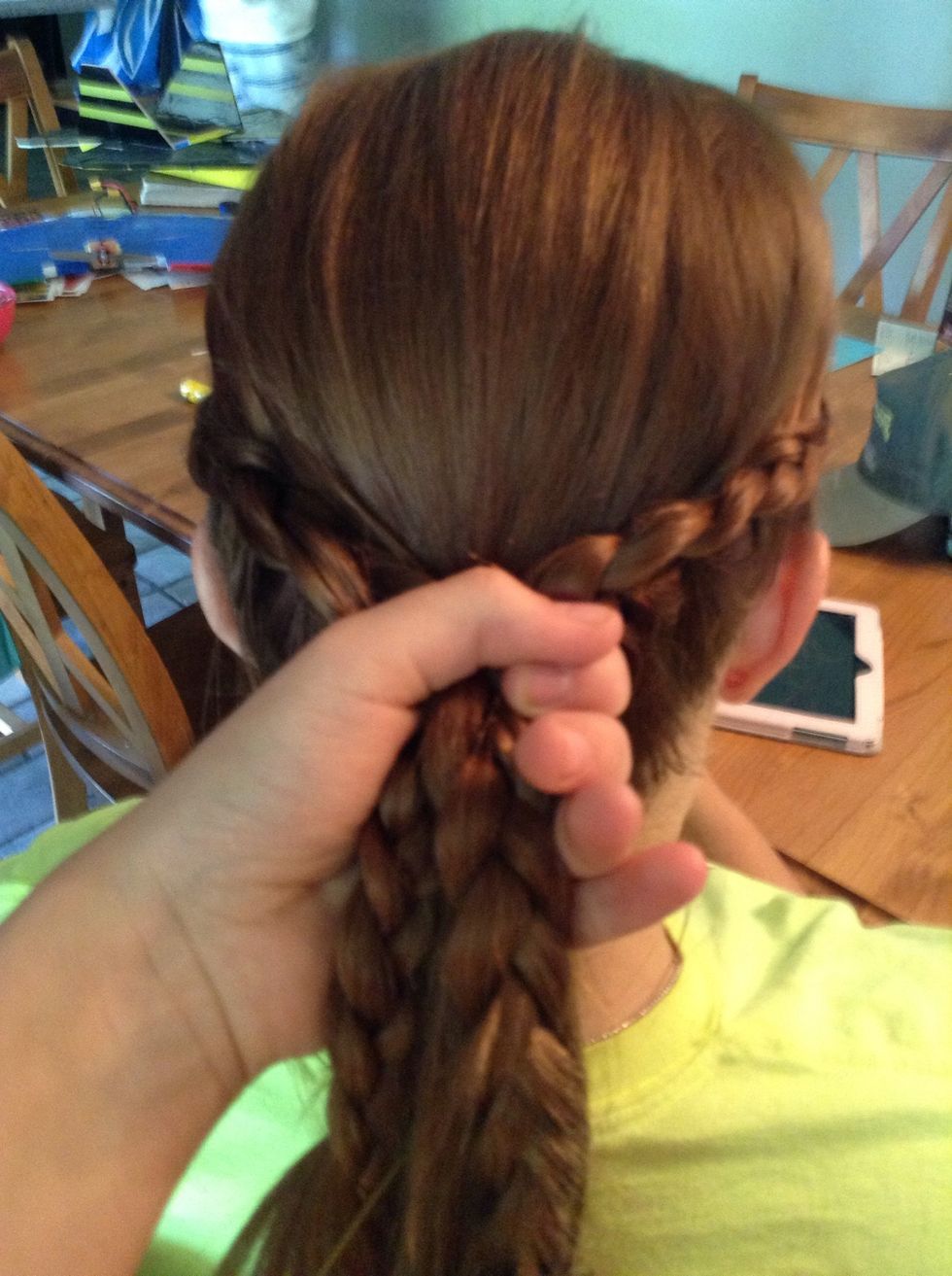 Gather hair into a ponytail...