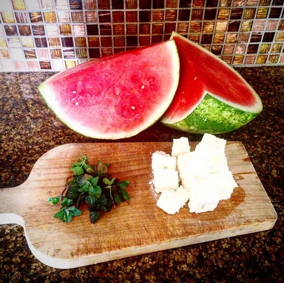 Gather ingredients , 1/2 Watermelon , 8 oz. package of Feta Cheese, a handful of Mint