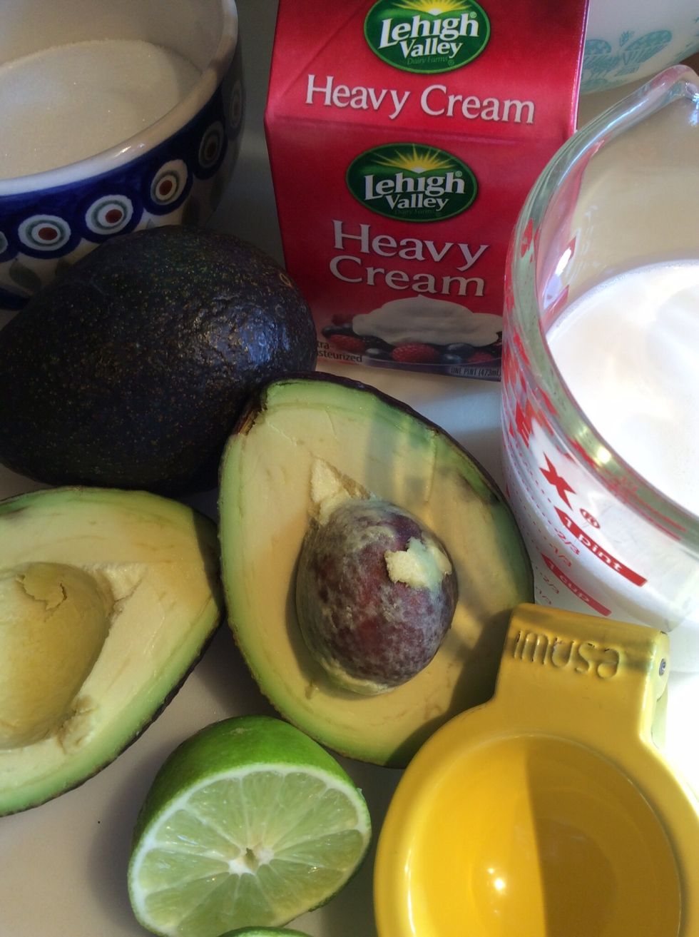Gather ingredients; 2 large avocados, juice of 1 lime, 3/4 c sugar, 1 tsp vanilla extract, 1 1/2 c half & half  and 1 c heavy cream.