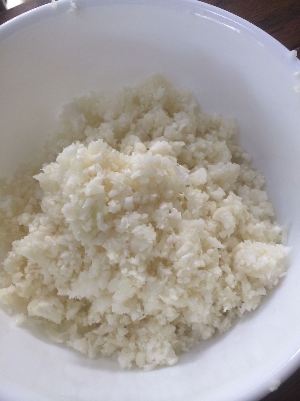 Gather ingredients. Cauliflower. This should be the texture. I grated mine with Vitamix. But you can you can use a food processor, blender or box grater.