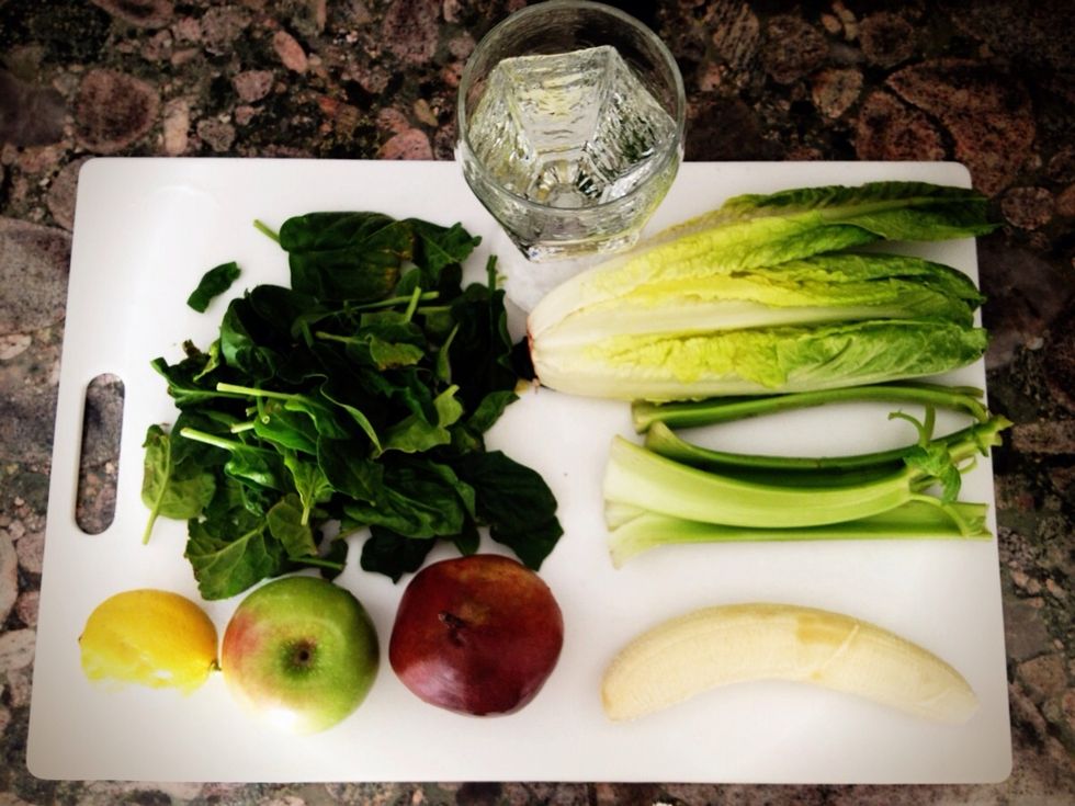Gather ingredients - see supplies tab. Chop up apple, nana, celery & pear, tear up lettuce & spinach leaves, squeeze lemon into water and add bit by bit, in any order you choose, to your blender.