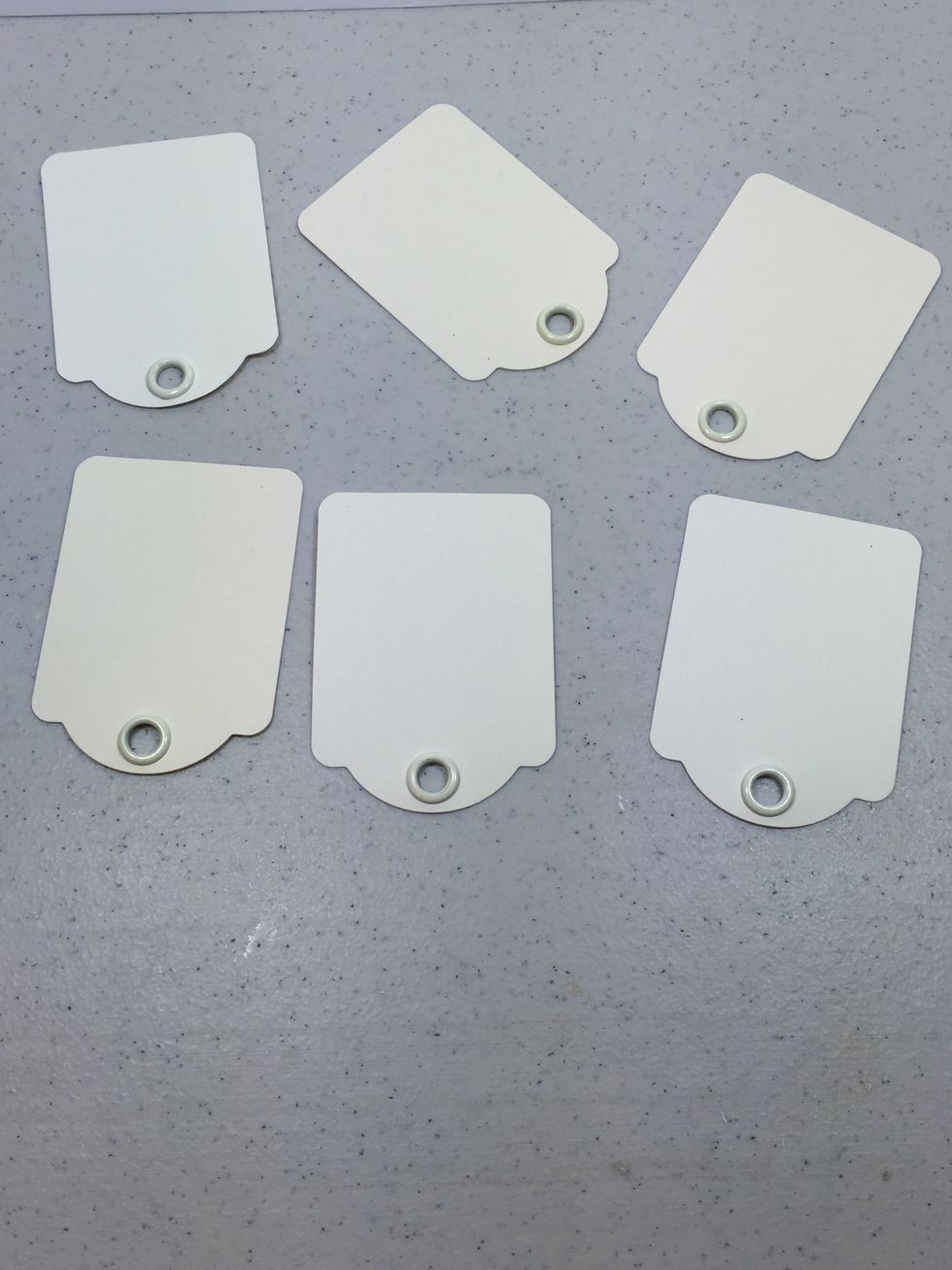 Gather six of the Graphic 45 ivory ATC tags.