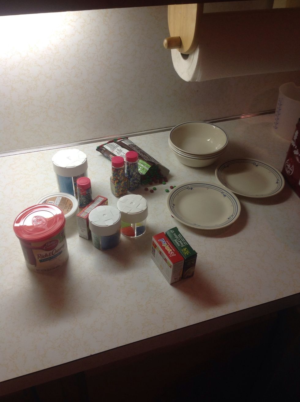 Gather some frosting and edible decorations.