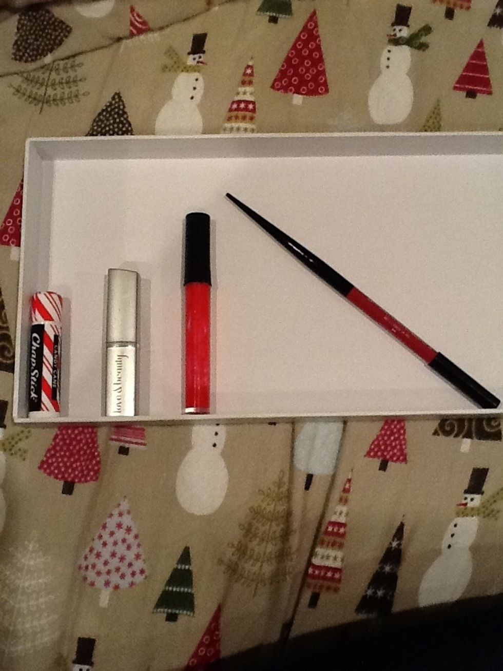 gather supplies-Chapstick, lipstick, lip gloss, and lip liner. (lipstick, lip gloss, and lip liner have to be same color. I'm using red)
