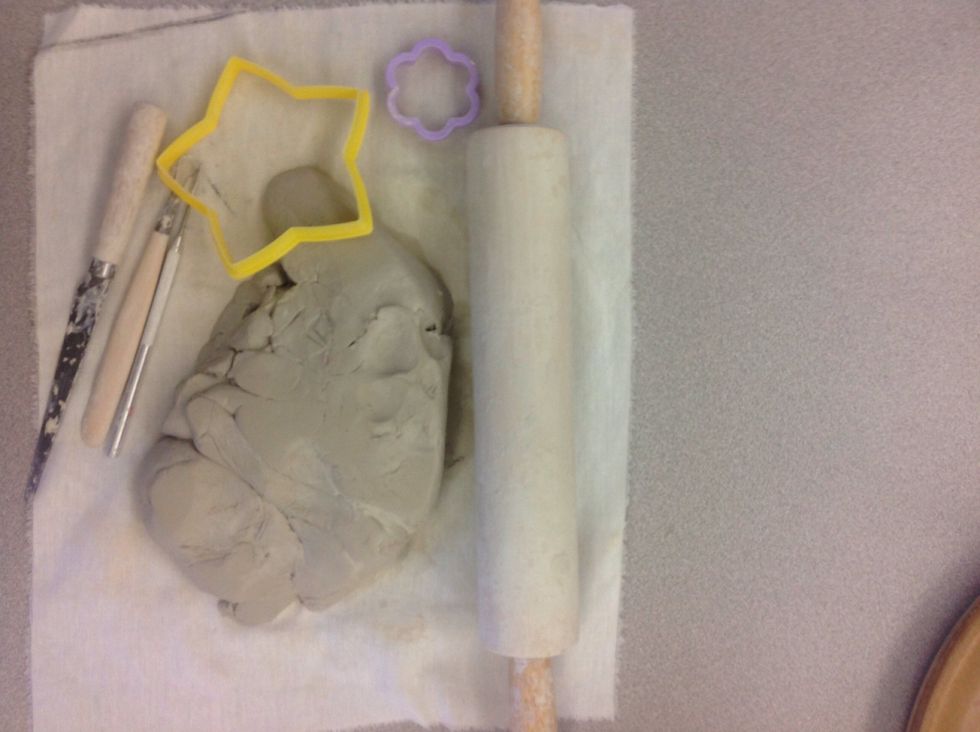 Gather supplies, including a cloth and rolling pin