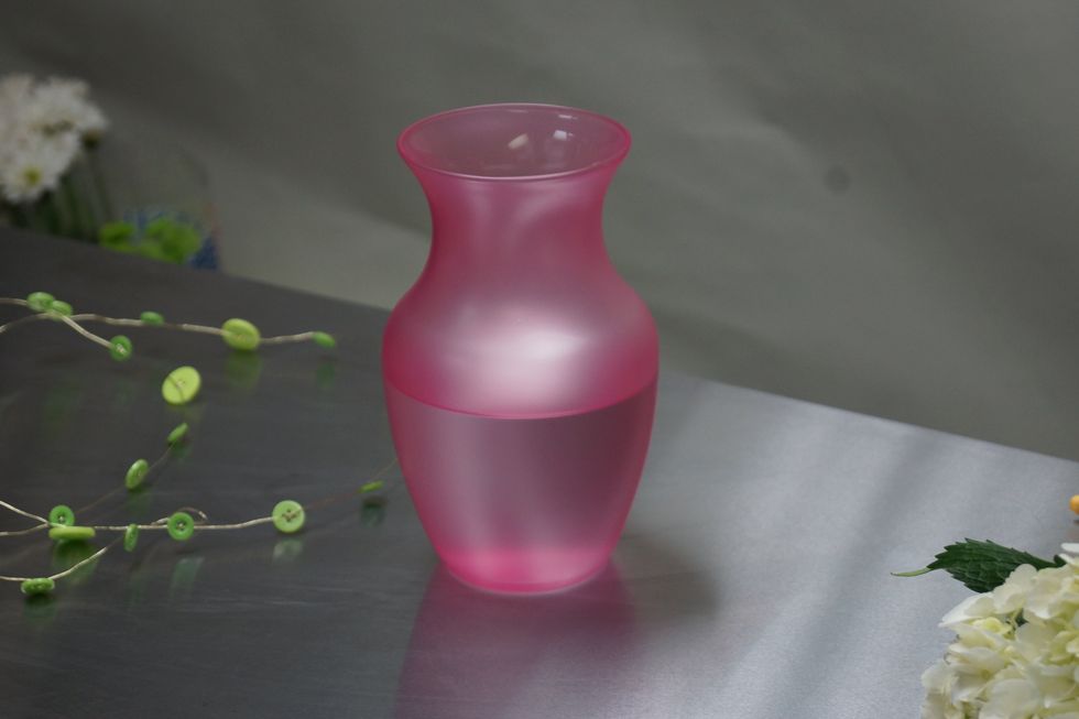 Gather supplies of flowers, vase and button wire.