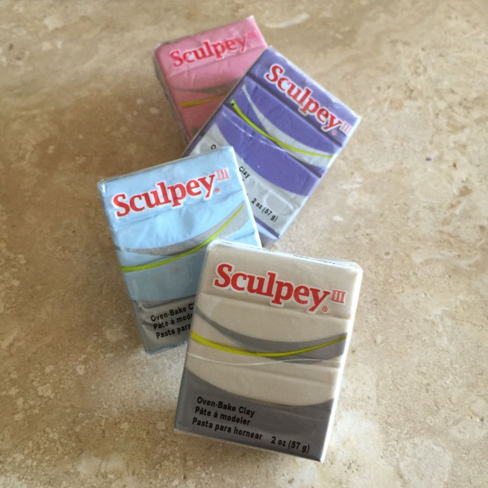 Gather the colors of sculpey oven-bake clay that you would like to create your totems out of. You can even mix them together for a tie-dye look!