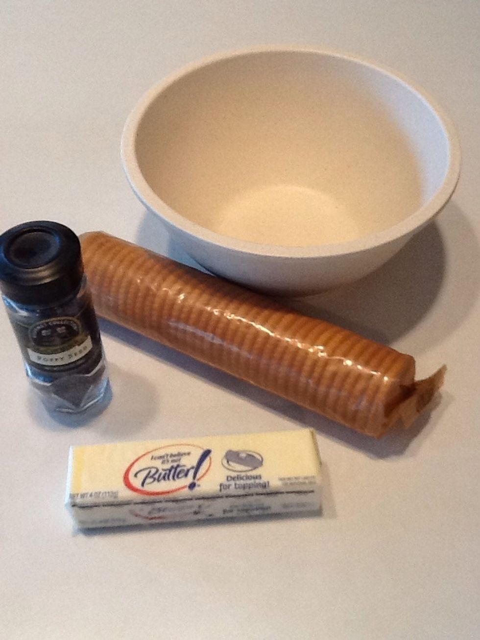 Gather the crackers, butter and poppy seed. Melt butter in a bowl.