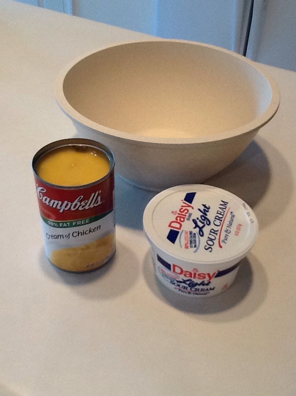 Gather the cream of chicken soup and sour cream.