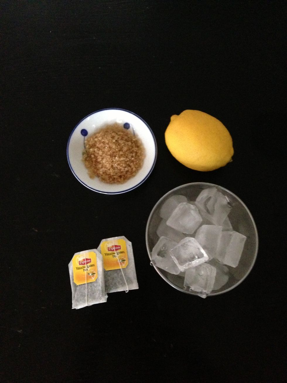 Gather the ingredients to your own preference. If you prefer a sweeter cup, add more sugar or if you'd like it to be zesty add more lemon an if you love the taste of tea, add an extra bag.