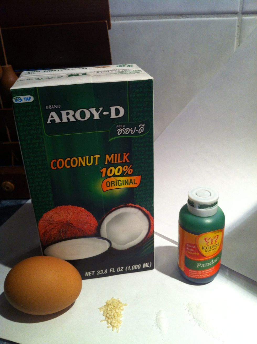 Gather the other ingredients: coconut milk, egg, pandan extract, sugar,salt & white sesame seeds