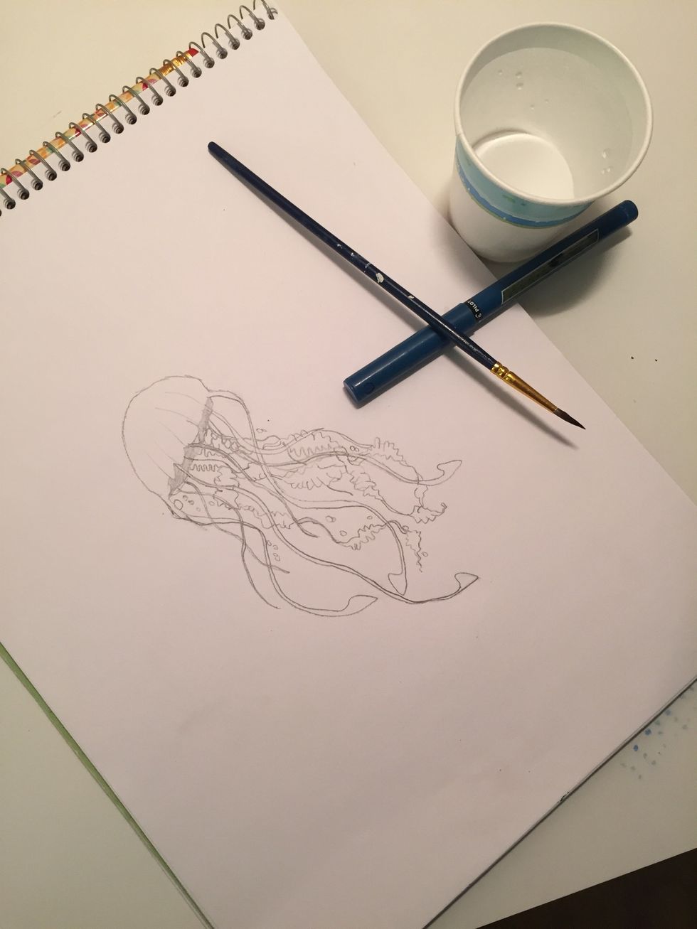 Gather the rest of your supplies- all you should need is your drawing, your blue or black pen, a cup of water, and a paintbrush. The paintbrush should be fairly small to help paint precisely.