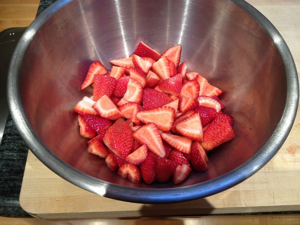 Gather the strawberries in a medium sized metal or glass bowl.