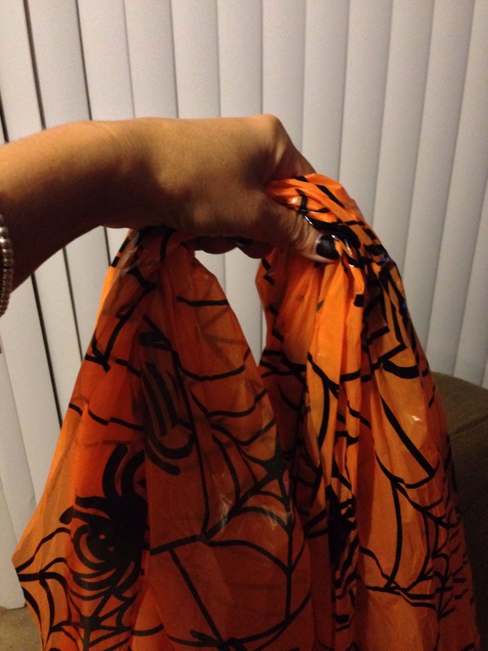 Gather the very center of the tablecloth