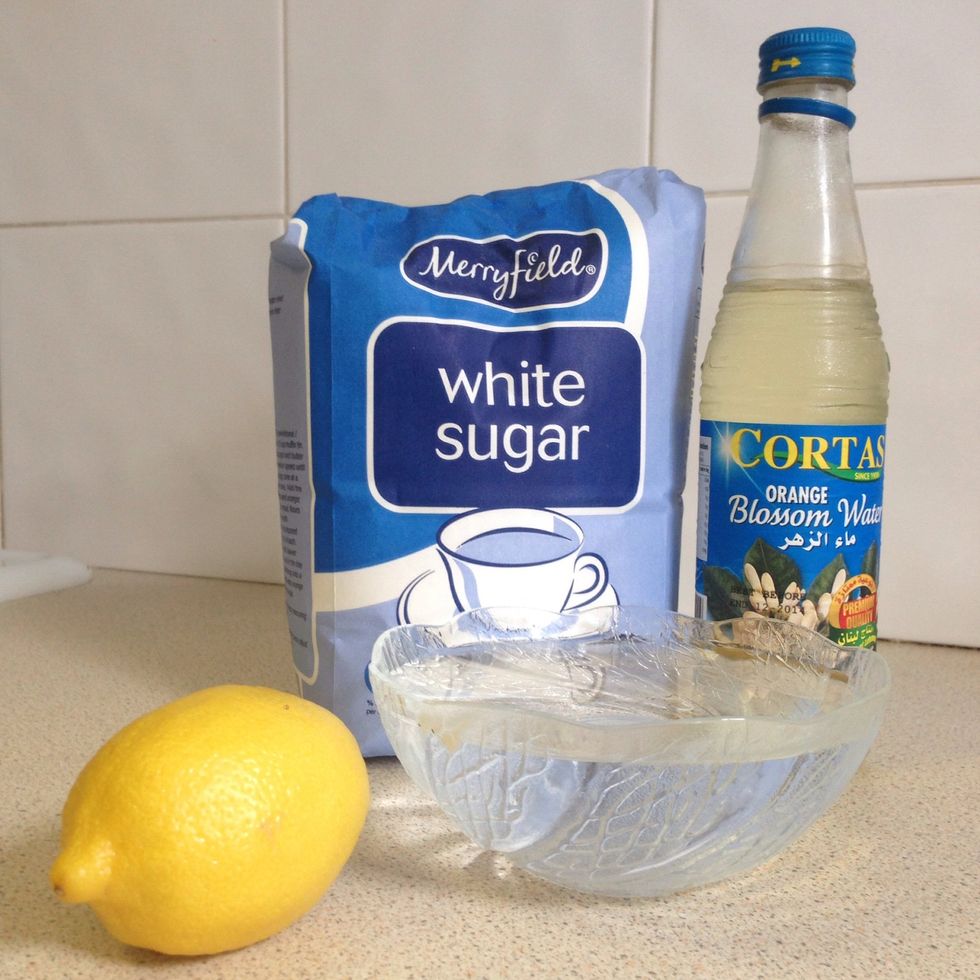Gather the water, 2 cups of sugar, lemon juice and the orange blossom water to make the simple-syrup (Attar).