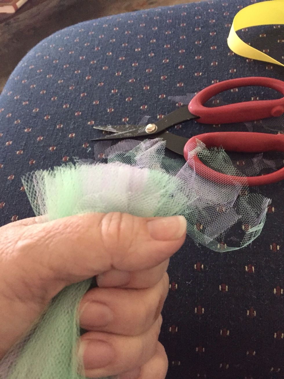 Gather tulle together in a bunch, and trim the top to make even.