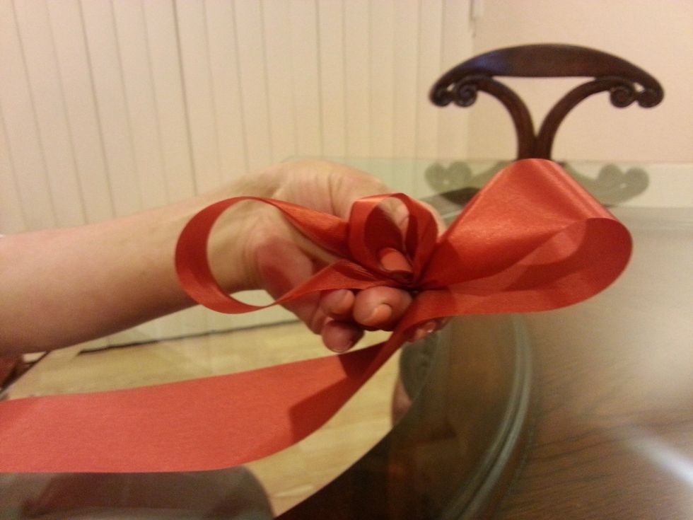 Gather, Twist & fold ribbon back to form next loop