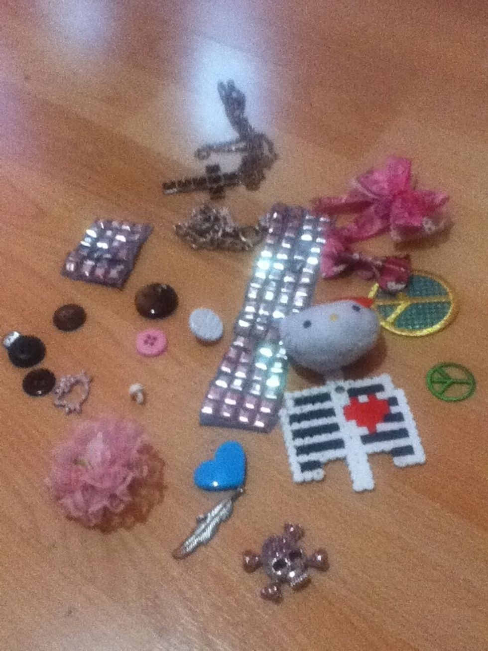 Gather up your random decorations for your jacket! If you like, you could purchase bows, pendants, button pins, etc. from a craft store. These are random things from my room!