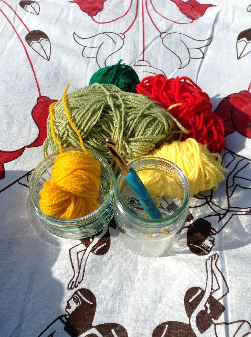 Gather whatever scrap yarn you have. If you only have a thin DK weight you can double it like I did. Use your fave crochet hook and any size jar. Mine used to be full of yogurt and cheesecake. Mmmm...