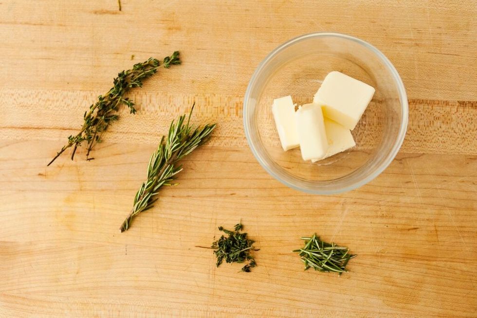 Gather your butter, rosemary and thyme. Make sure to pull off  the thyme and rosemary leaves off the branch.