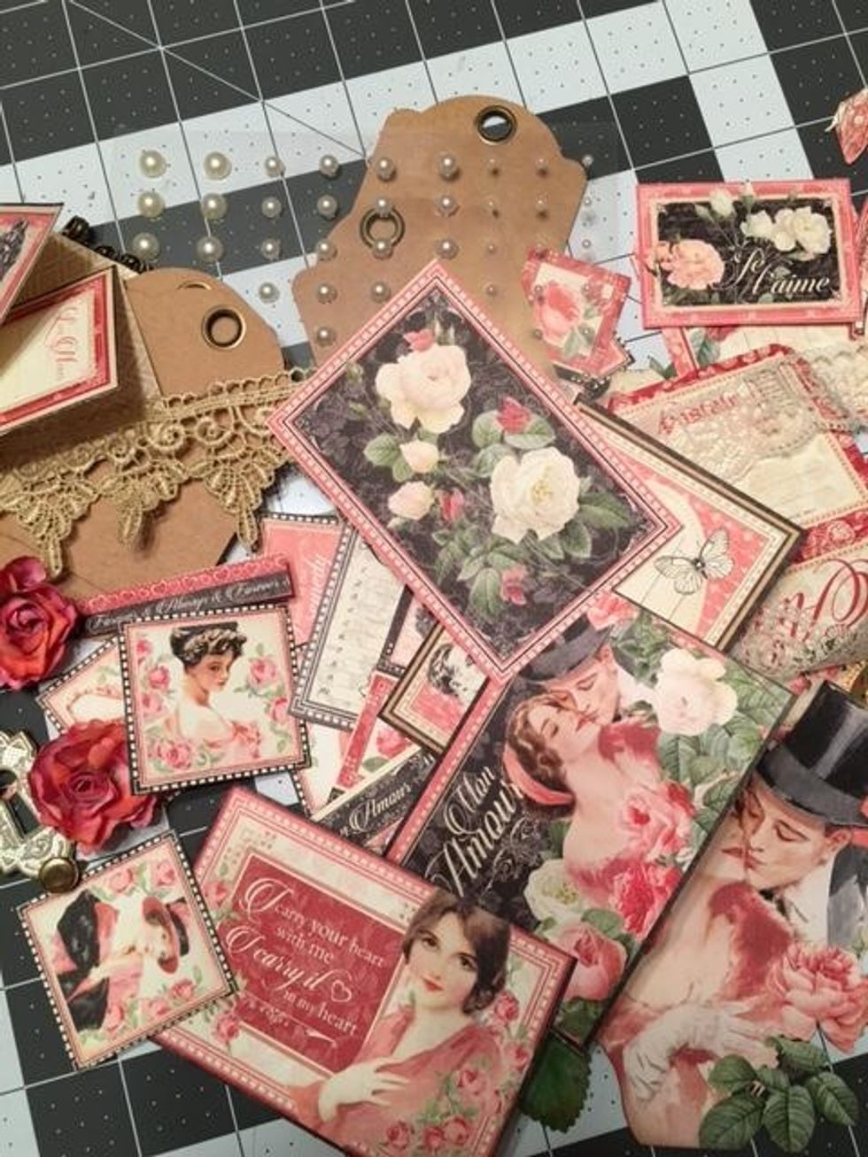 Gather your decorative supplies--Cut outs from the paper, sequins, rhinestones, pearls, ribbon, lace, roses, Graphic 45 metal items such as a key and key hole etc.