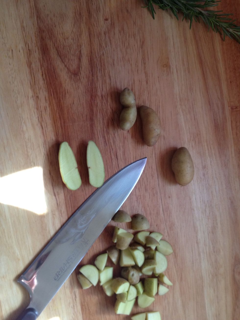 Gather your favorite potato and cut in length wise. Then cut across to get the home fry shape
