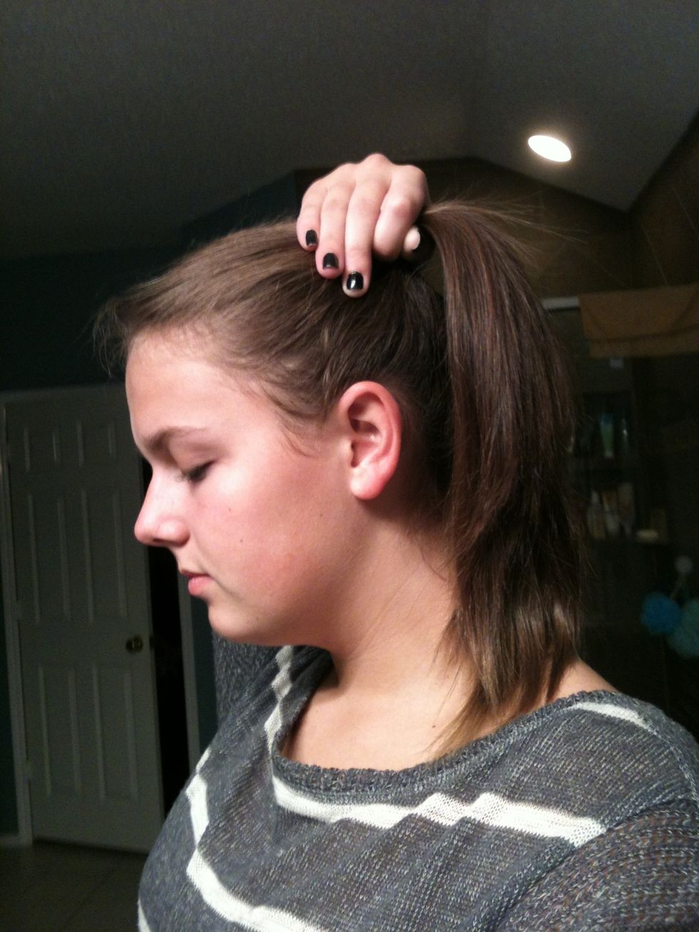 Gather your hair into a high side pony. (doesn't matter which side:)