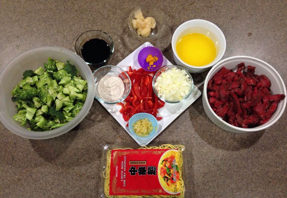 Gather your ingredients! Broccoli, chopped; red pepper, julienned; onion, diced; orange, juiced & zested; garlic, minced; steak, pounded to 1/4 inch & thin sliced; flour, honey, & soy measured out.