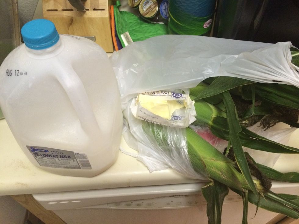 Gather your ingredients! Corn on cob, milk and butter! Peel the corn, fill up a pot with water add a splash of milk, and a square of butter! **I don't put measurements!it depends on the amount cooked!