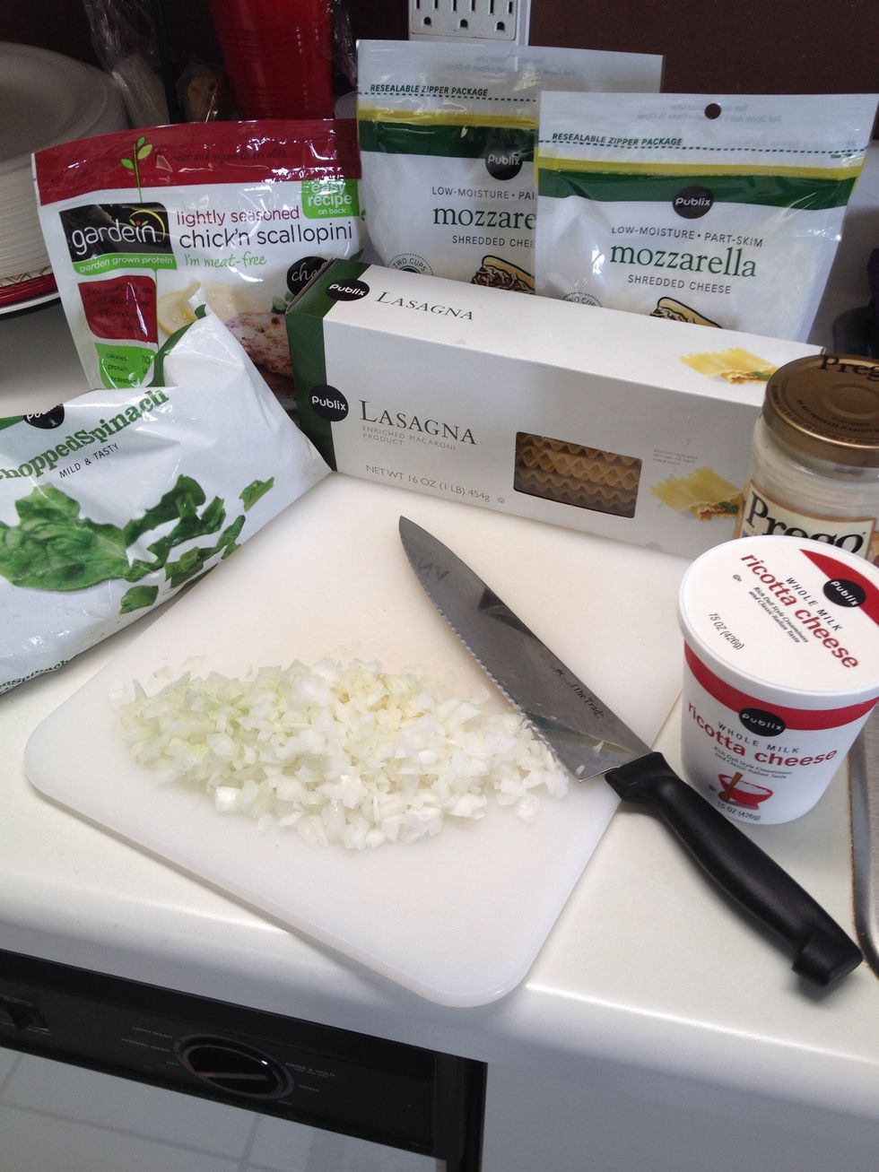 Gather your ingredients. I always chop my onion and garlic to start. Half of onion diced and 2 cloves of minced garlic.