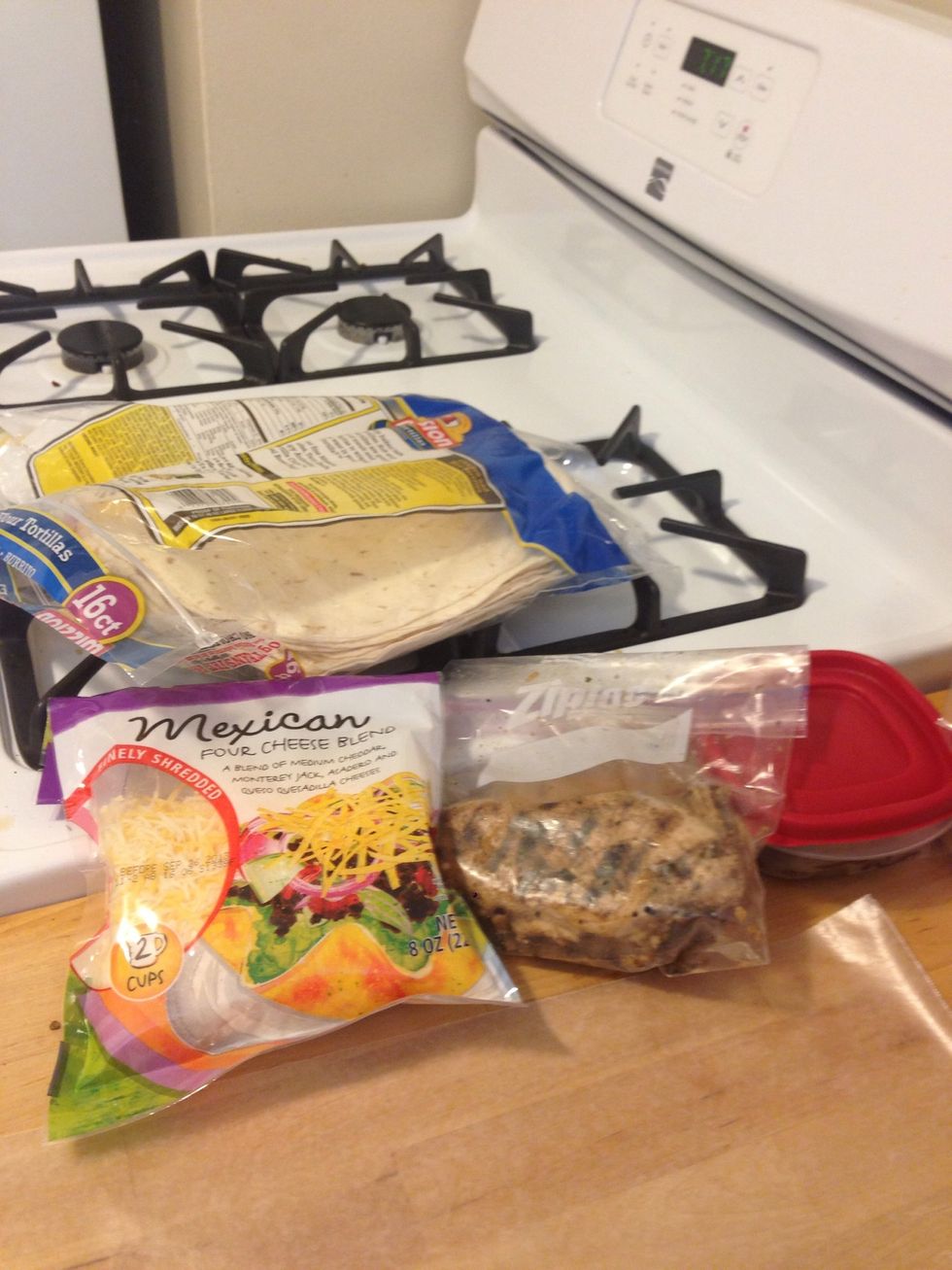 Gather your ingredients. I chose Mexican blend cheese to compliment my leftover fajita meat. Start the grill on medium heat.