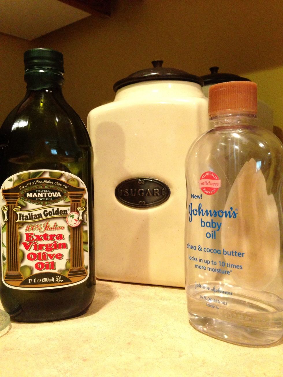 Gather your ingredients. I have olive oil in this pic because you can use it in place of baby oil. Likewise you can use salt in place of sugar. You just need an abrasive agent and an oil.