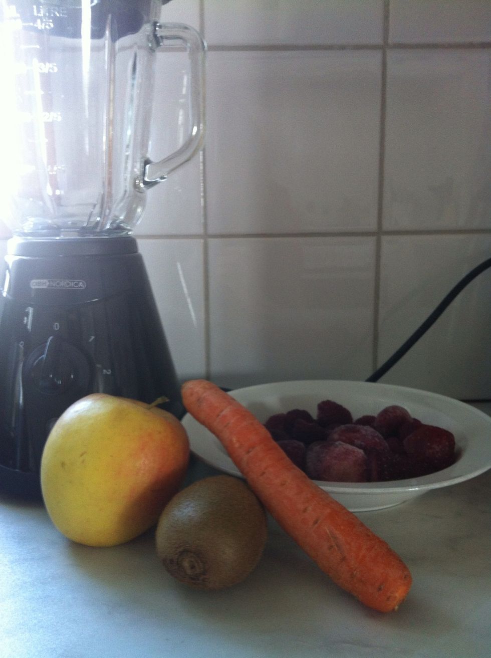 Gather your ingredients, these are the fruits and vegetables I chose, but you can choose whatever you want to. I put the frozen berries in the microwave for a minute before..