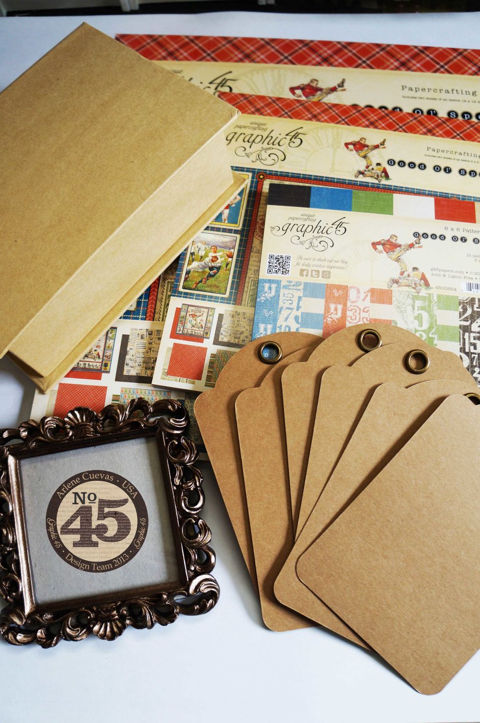 Gather your materials. Basics: Graphic 45 design paper, Staples Book Box, Staples Regular Tag Album, frame from craft store dollar bin\u2026