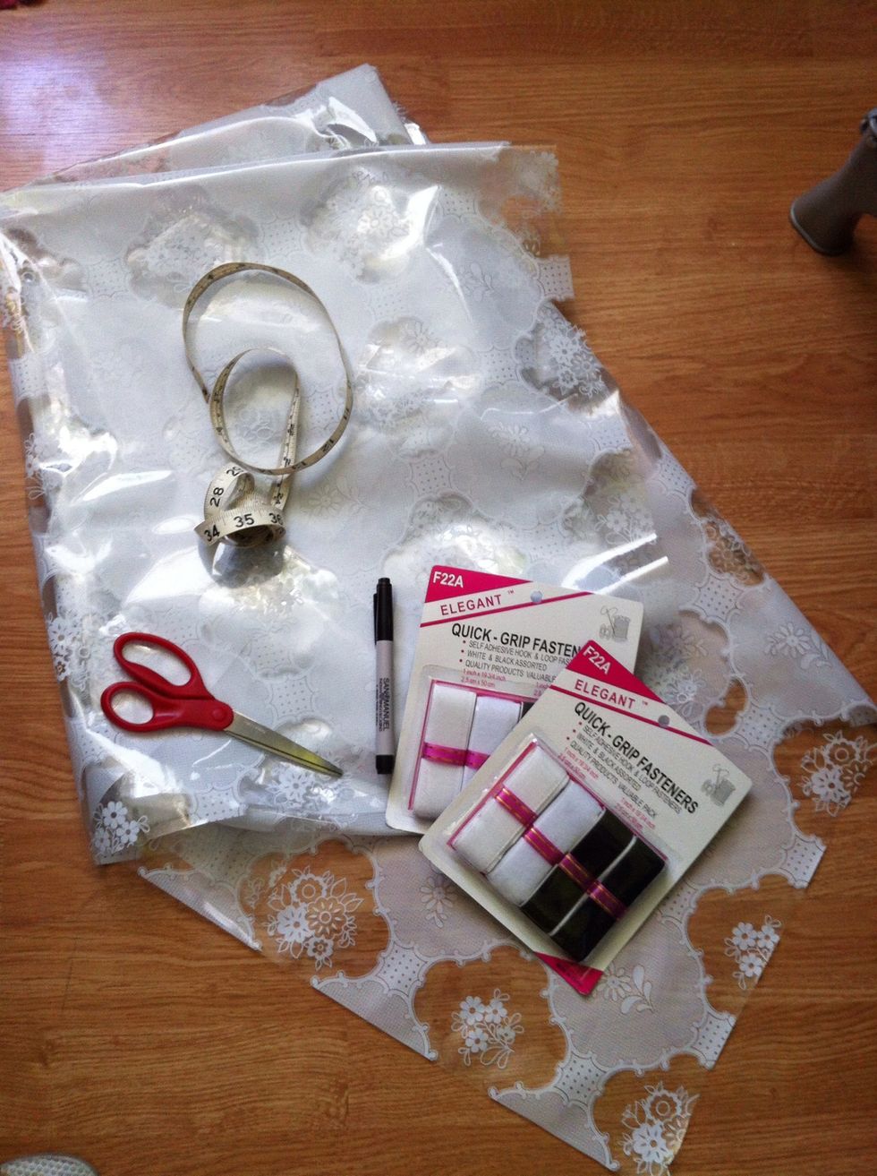 Gather your materials. I had the vinyl left over from a previous project. But I got it from the local dollar store. Same goes for the self adhesive Velcro.