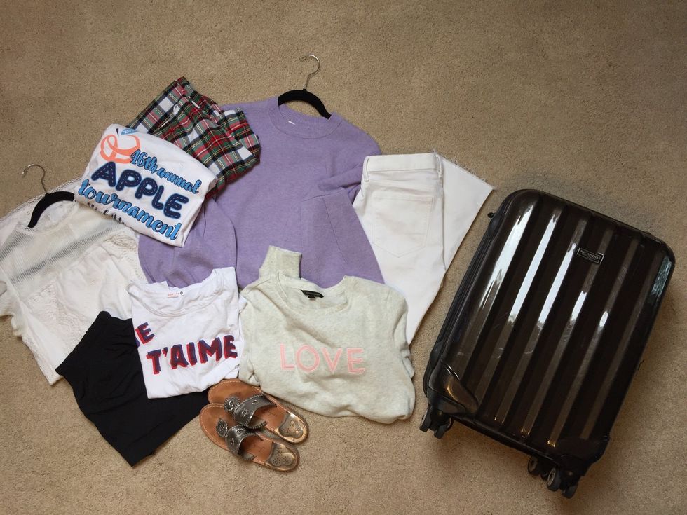 Gather your materials: suitcase and clothes.