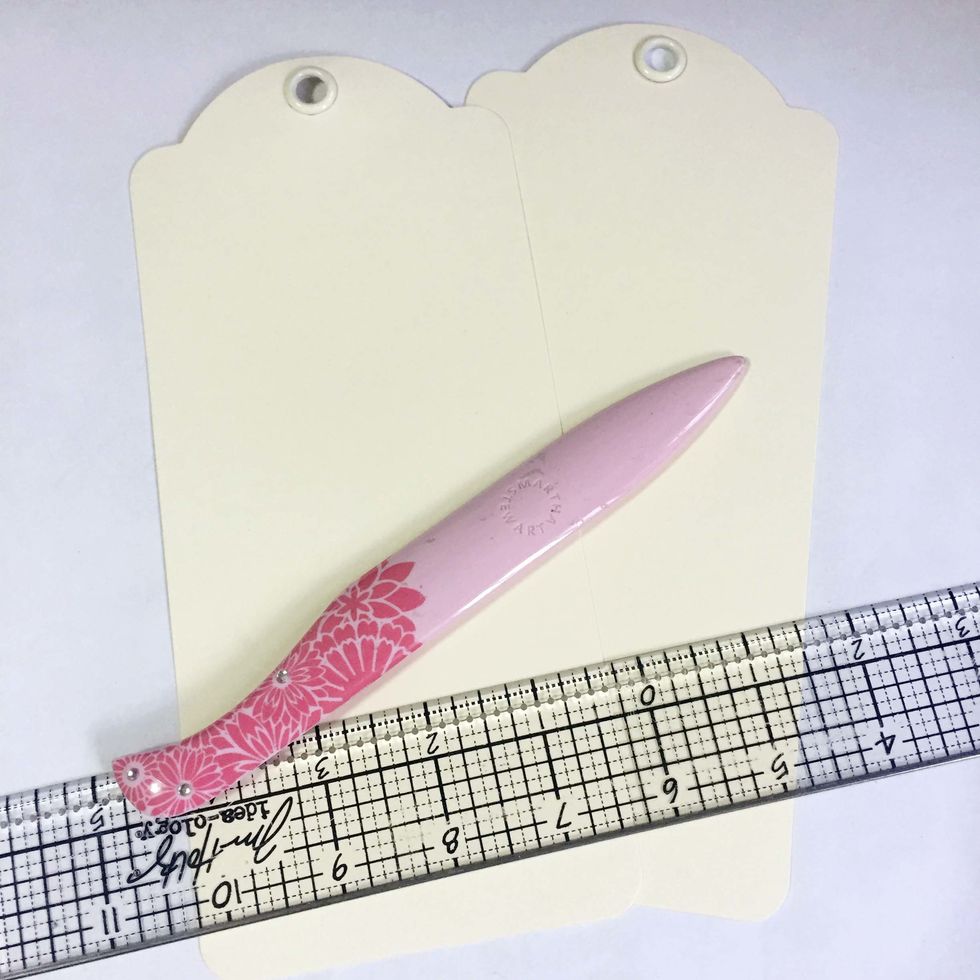 Gather your supplies, a list of supplies can be found at the bottom of this guide. You will need 2 large ivory tags for a gift box.