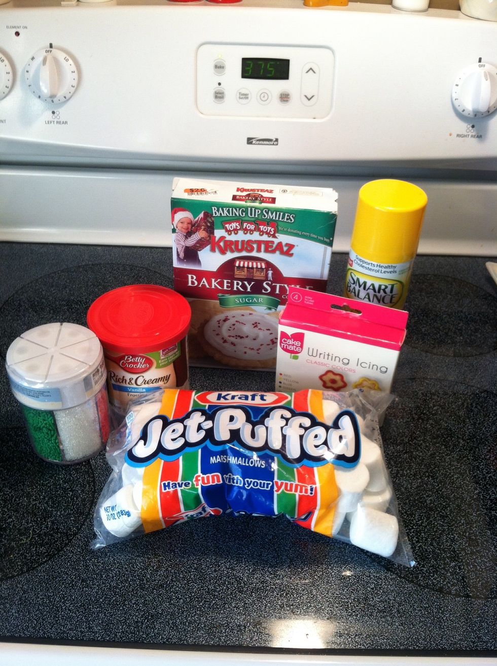 Gather your supplies and get ready to start. Don't forget to preheat your oven at this time. I didn't really use that colored decorative sugar on the left.