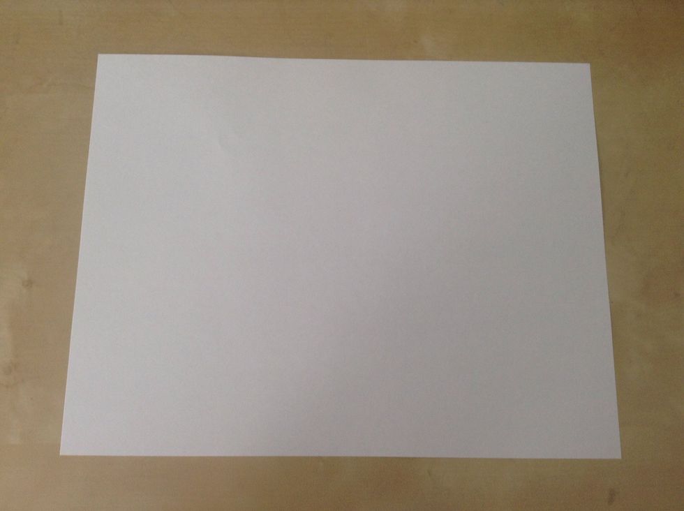 Gather your supplies for your paper airplane (3 pieces of paper)