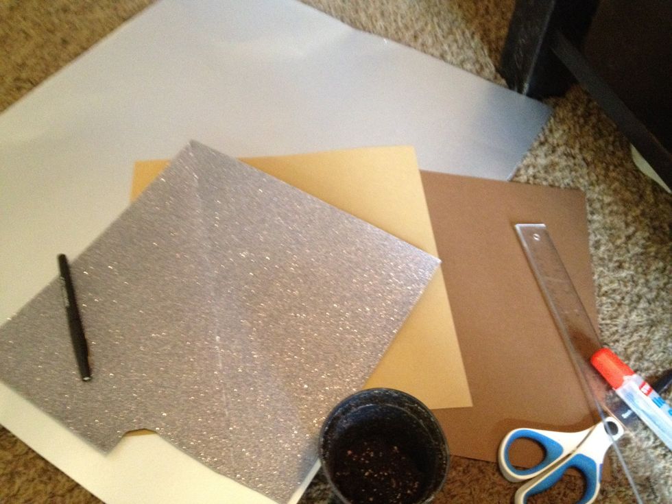 gather your supplies. I chose two shades of brown paper for the handle and shaft of the shovel, and a glittery silver and silver sheen paper for the blade.