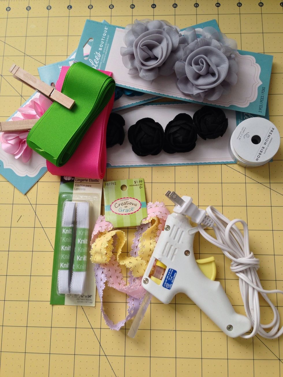 Gather your supplies. I found some cute little flowers in the scrapbooking section of my craft store. My baby is small so I didn't want to spend a lot on the larger flowers in the hair section.