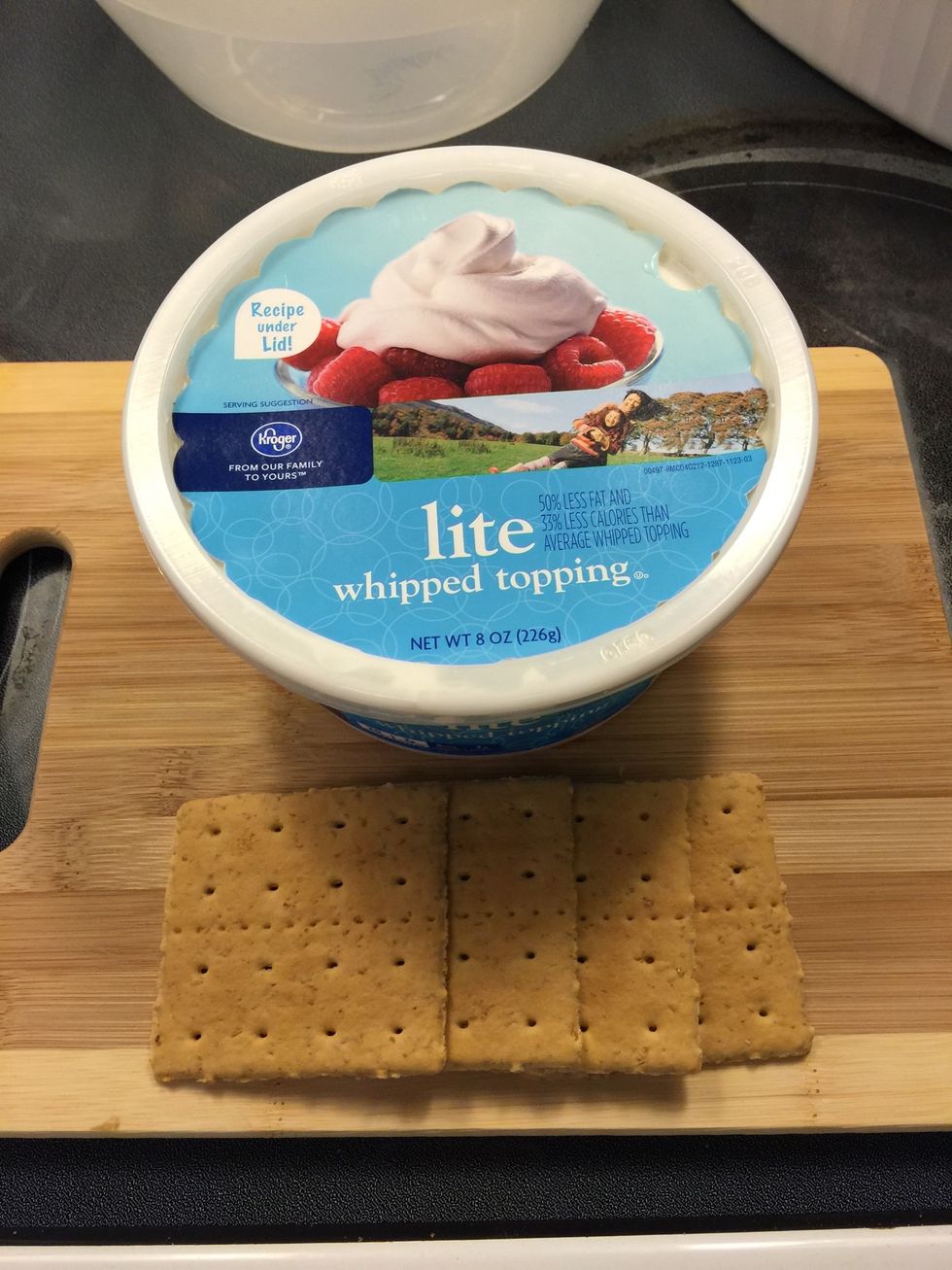 Gather your supplies: Light whipped topping in a tub. Frozen is fine and, in fact, would actually be easier to "slice" into squares. 2 full sheets of graham crackers for 4 squares.