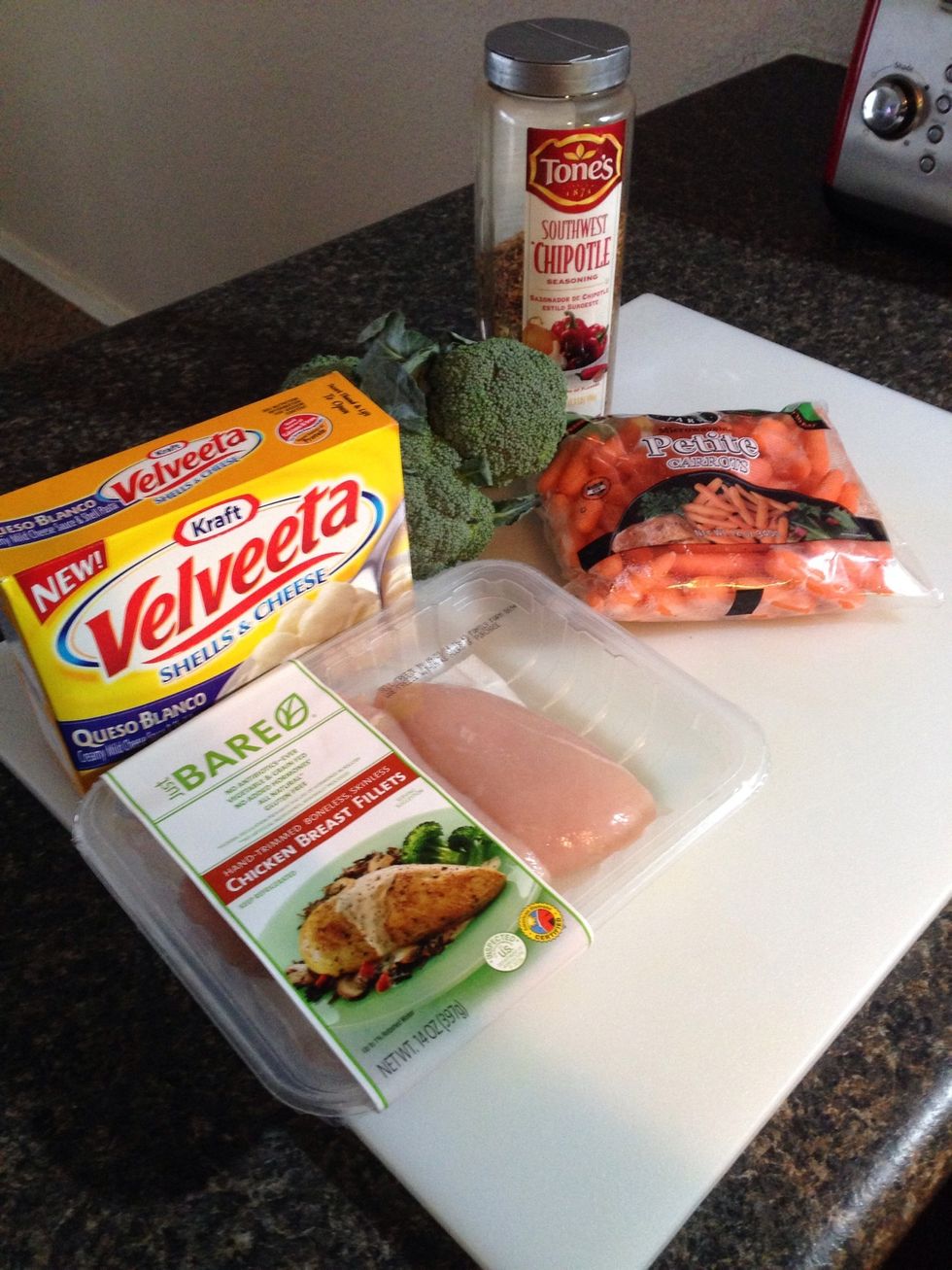 Gather your supplies, plus milk. I'm going for a spicier version so I'm using chipotle seasoning. Goes with the queso blanco velveeta nicely