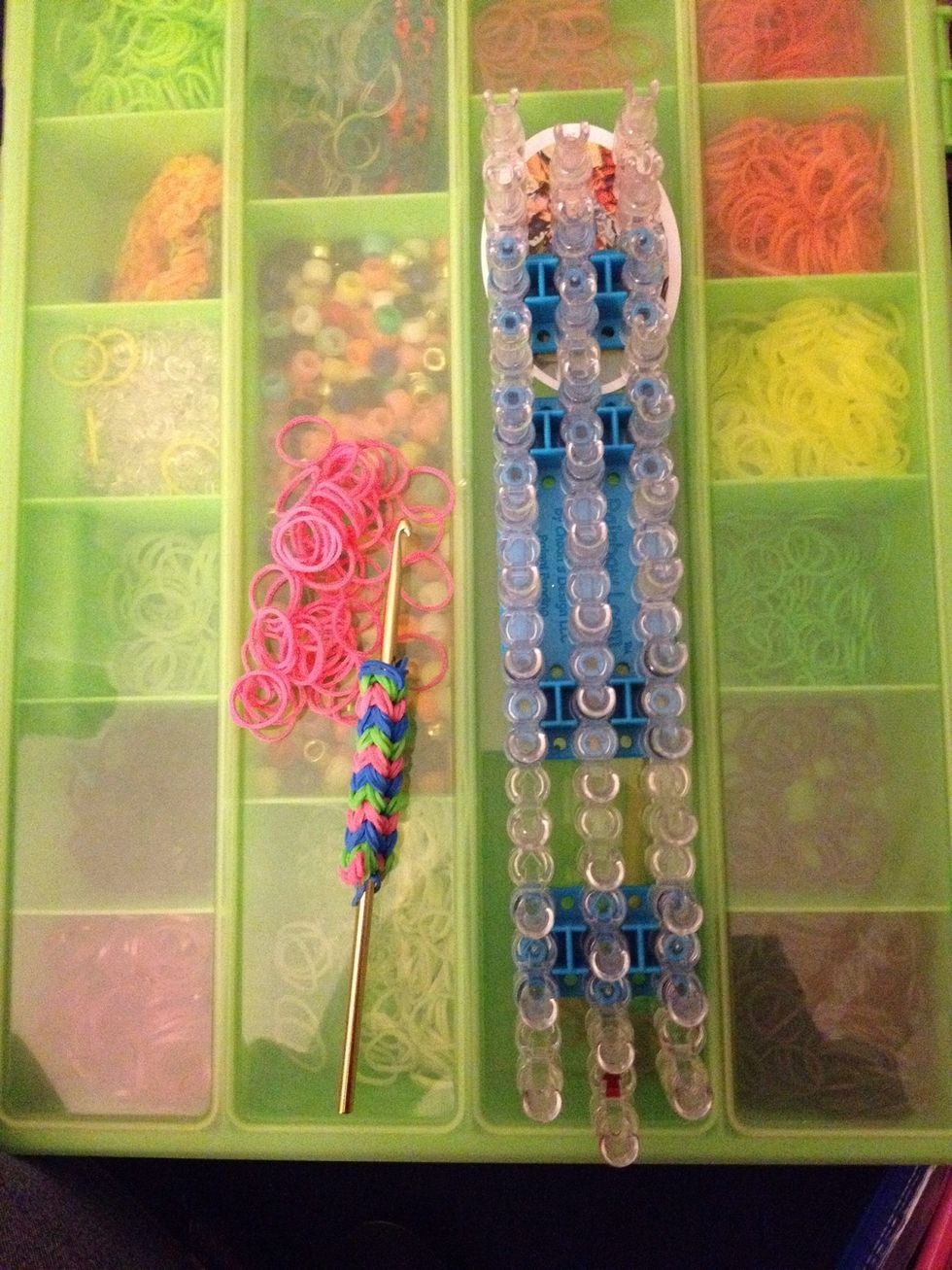 Gather your supplies, Rainbow Loom, hook and 47 pink rubber bands. If you would like to do a different awareness ribbon please feel free. All the steps are the same.