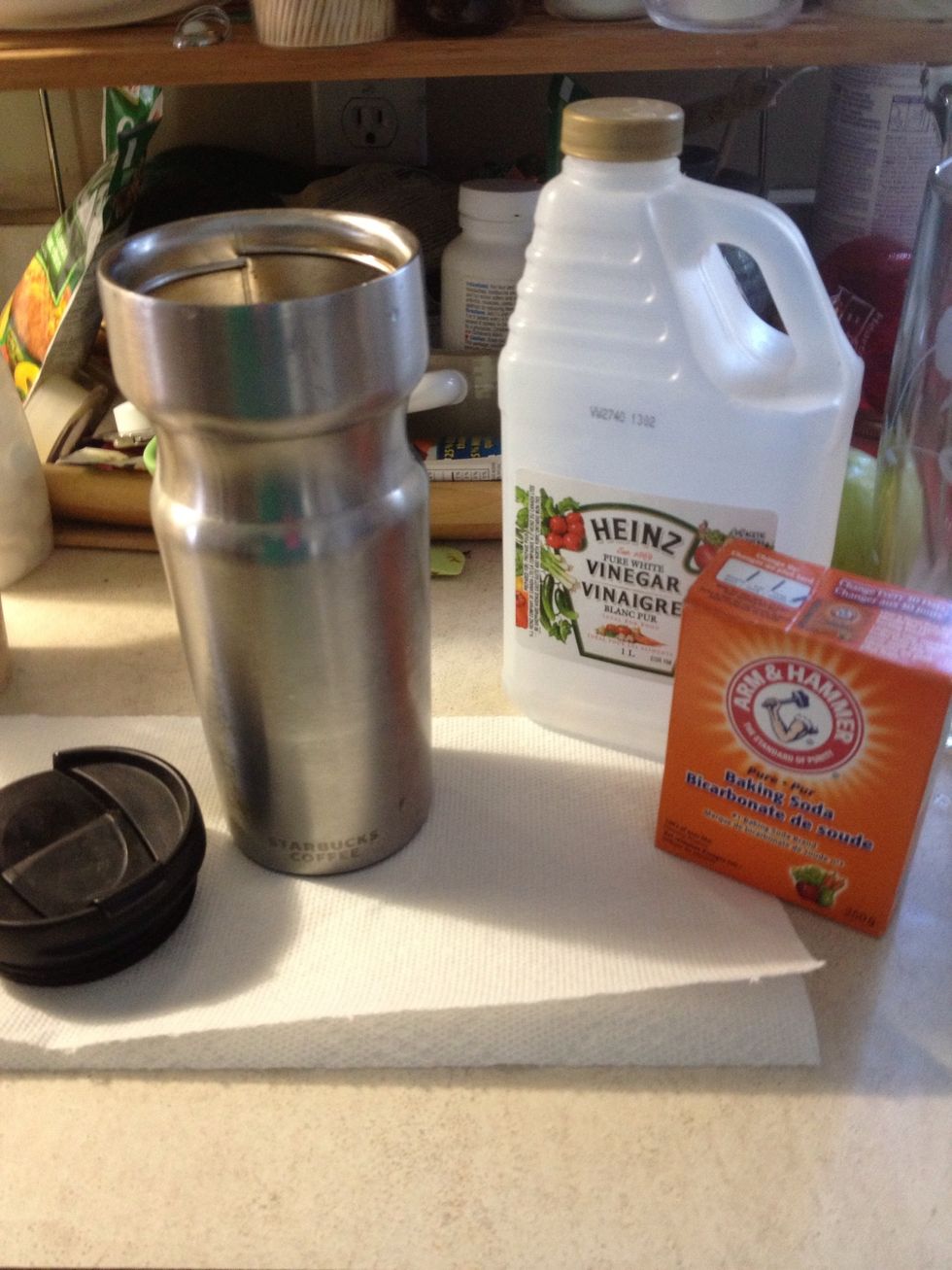 Gather your supplies. Start by adding baking soda to your mug. Don't add too much cuz not all will dissolve in the vinegar. You can do this multiple times and often.