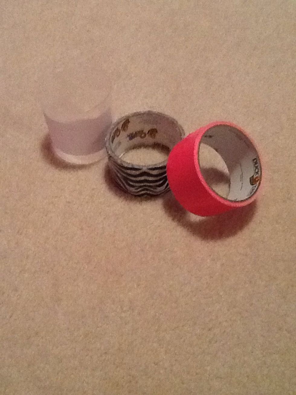 Gather your supplies. You will need a plastic container (mine is just from some q-tips) , solid duck tape, and patterned duck tape. Ribbon and glue will work fine if you don't have duck tape.