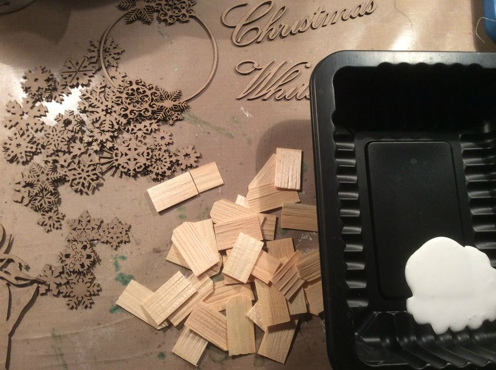 Gather your wood, and chipboard pieces and give them all a coat of white acrylic paint.