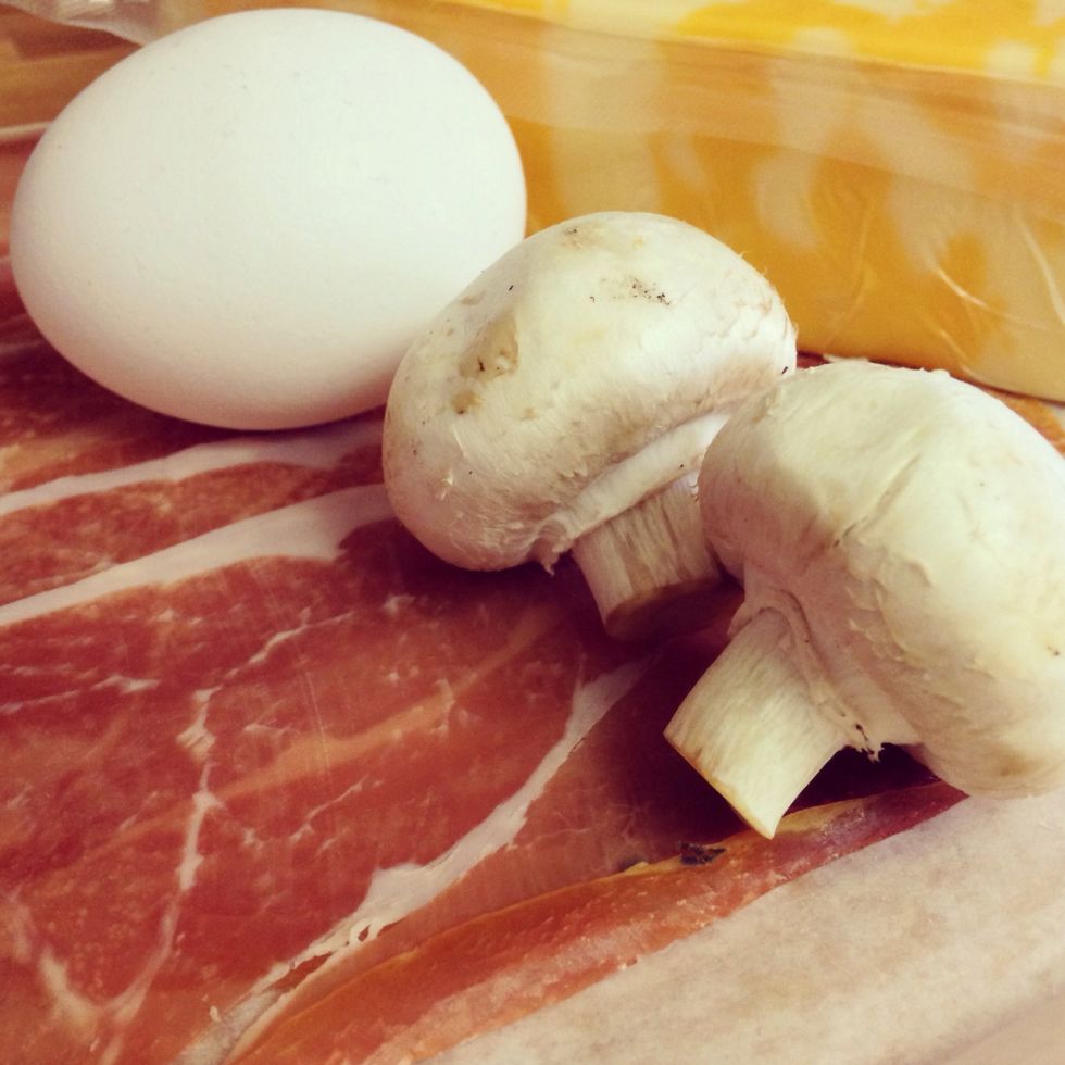 Gathering the ingredients. Dice up mushrooms, pepper and potatoes into small chucks. Grate cheese.