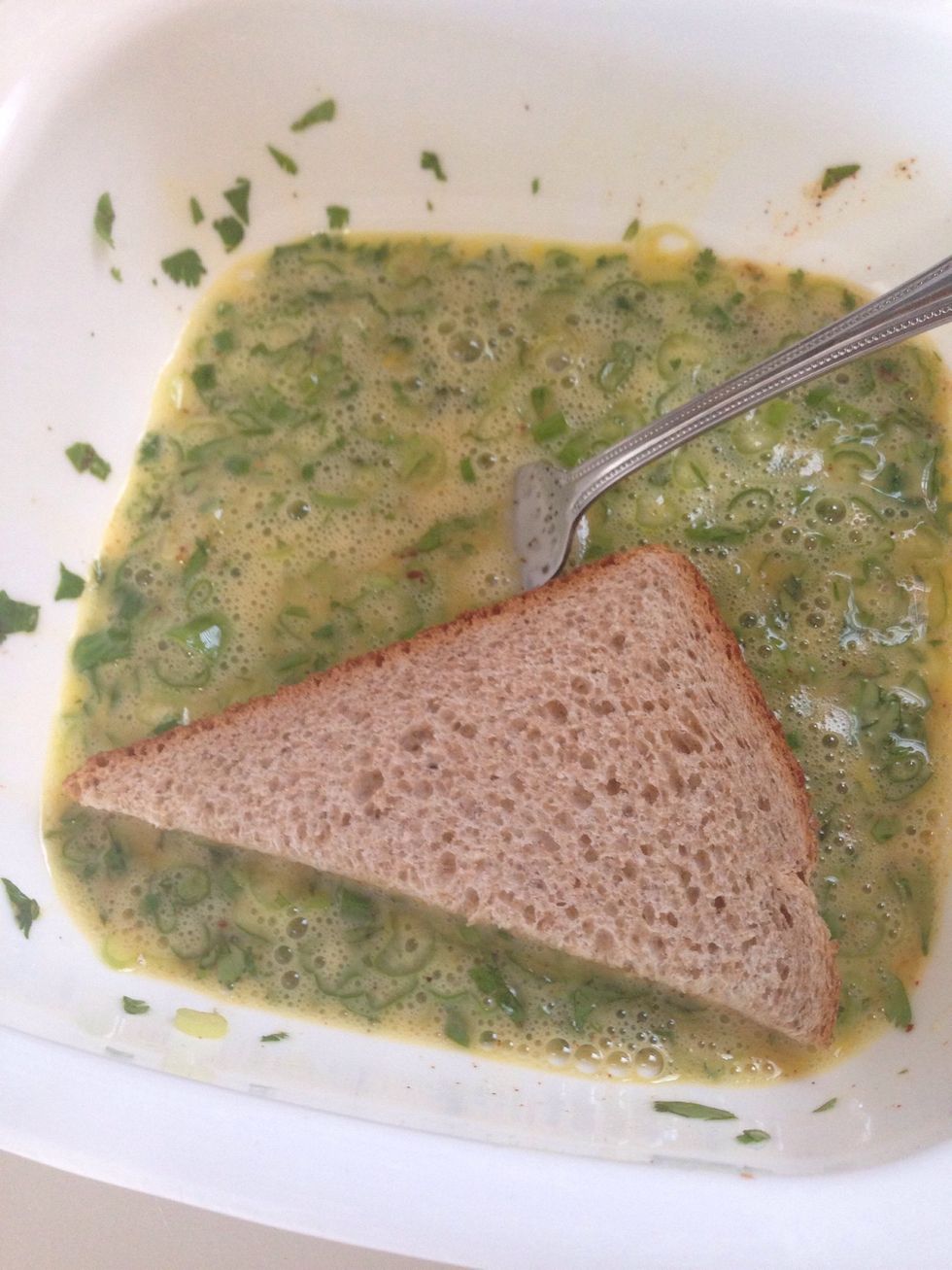 Generously coat the bread in the egg mixture and put in on your skillet