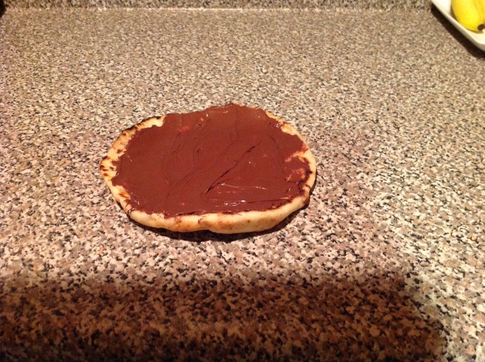 Generously spread the Nutella on your naan bread :)